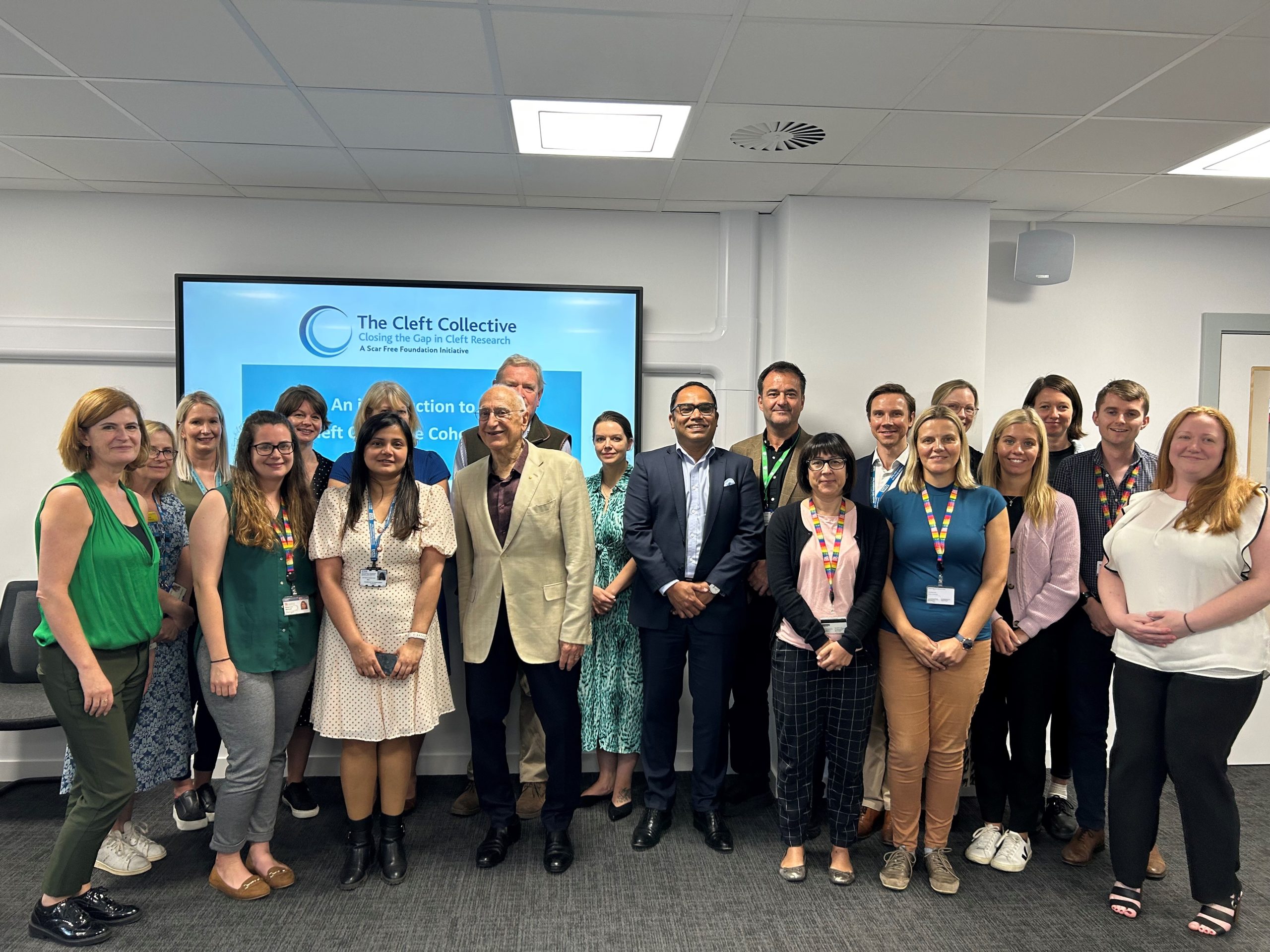 Diverse group of professionals at Craniofacial Australia conference about craniofacial conditions an.