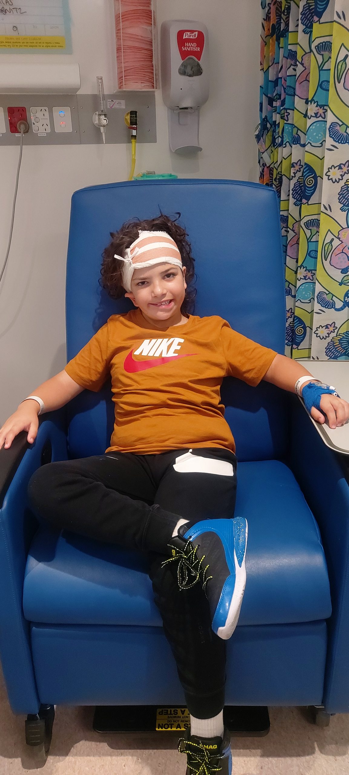 Boy with hemifacial microsomia with bandage on head