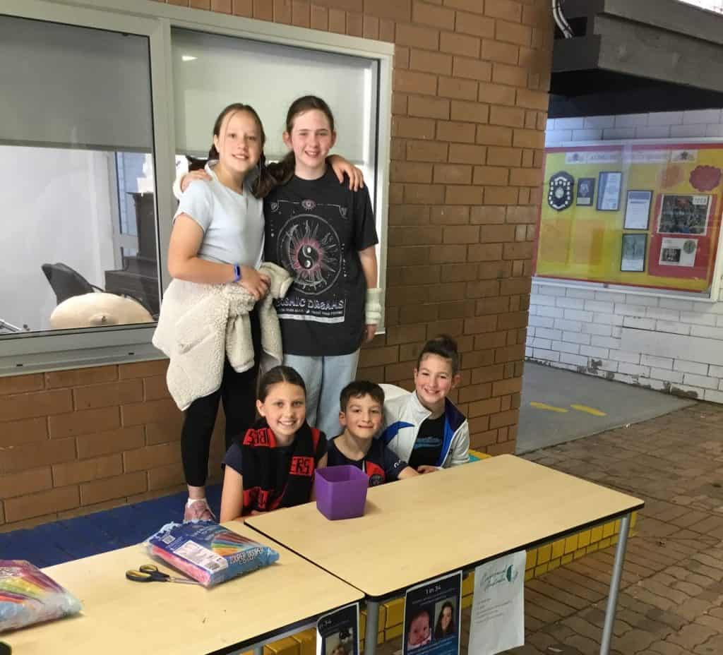 Helping children with craniofacial conditions at fundraising event in Australia.